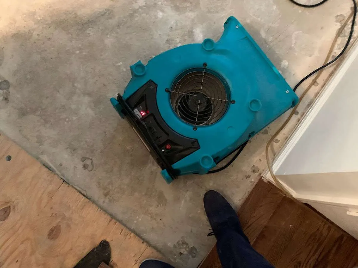 Air mover drying subfloor during Leak Detection & Repair in Soquel